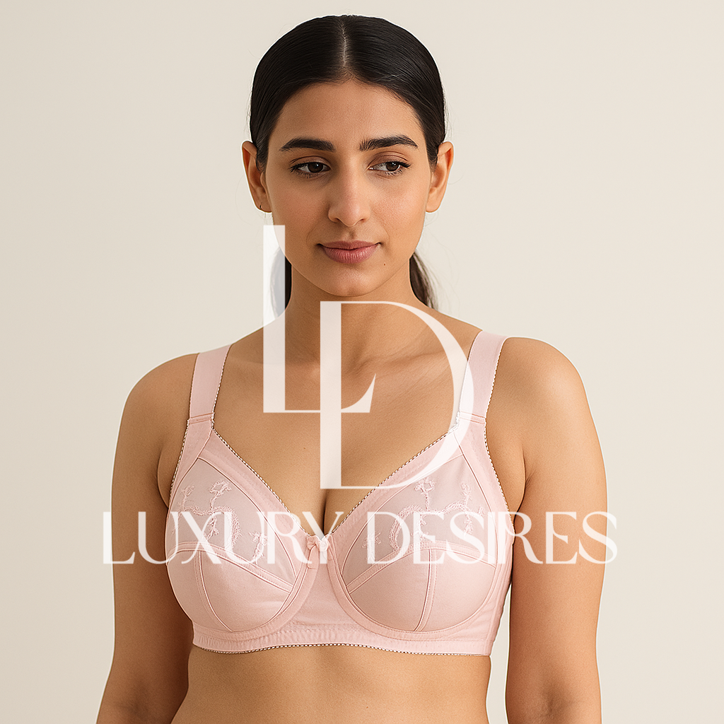 Woman wearing a pink bra with 'Luxury Desires' Florish